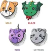 Four different character-themed holders for AirTags are displayed against a white background. Produktbild-Vorschau