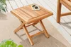 A wooden side table on a rug on a deck. Produktbild-Vorschau