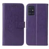 A purple flip phone case with a floral and butterfly embossed design is shown open and closed. Produktbild-Vorschau