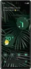A smartphone screen displaying widgets and app icons on a dark green leafy background. Podgląd zdjęcia produktu