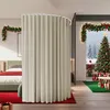 A bedroom decorated for Christmas with a large beige curtain room divider. Produktbild-Vorschau