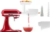 A red KitchenAid stand mixer with a white juicer attachment is shown, with juice being dispensed into a glass bowl. Voir les images du produit