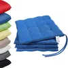 A stack of colorful seat cushions on a white background. Produktbild-Vorschau