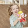 A young girl is happily playing with a Mr. Potato Head toy. Anteprima dell’immagine prodotto