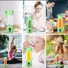 Collage of images showing a portable blender in various settings: on a counter, being used by a woman at a desk, in a kitchen, by a woman doing yoga, feeding a baby, and during a picnic. Náhled obrázku produktu