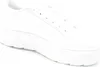 A close-up, side view of a white Puma Karmen L sneaker with a platform sole. Produktbild-Vorschau