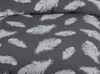A close-up view of a duvet cover with a feather pattern. Produktbild-Vorschau