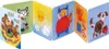 A children's book with multiple pages, each depicting a different scene with cartoon characters. Voir les images du produit