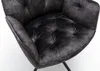 Close-up view of a tufted armchair seat and armrest. Produktbild-Vorschau