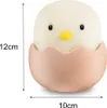 A cute chick in an eggshell-shaped night light with size dimensions indicated. Produktbild-Vorschau