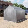 A silver tent or shelter is set up on a construction site, with scaffolding and a building under construction in the background. Produktbild-Vorschau