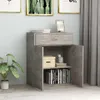 A grey cabinet with one drawer and two doors stands against a light blue wall. Books and decorative items are on the shelves. A potted plant is to the left, and grey curtains are to the right. Anteprima dell’immagine prodotto