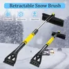 A product image showing a retractable snow brush and ice scraper with a winter road scene in the background. Voir les images du produit