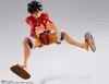 A figurine of Monkey D. Luffy from One Piece in a dynamic pose against a plain background. Podgląd zdjęcia produktu