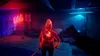 A dimly lit room with neon lights and a glowing figure. Podgląd zdjęcia produktu