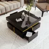 A modern living room setting with a black coffee table with gold accents and drawers. Náhled obrázku produktu