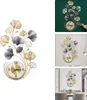 A collage of images showing a decorative wall clock with a floral design, displayed in different settings and on different backgrounds. Produktbild-Vorschau