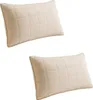 Two beige quilted pillows are shown against a white background. Náhled obrázku produktu