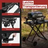 A portable gas grill set up on a folding table outdoors. Produktbild-Vorschau