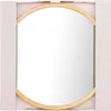 A round mirror with a wooden frame, presented in its packaging. Voir les images du produit