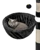 A cat is resting in a black hammock attached to a cat tree. Produktbild-Vorschau