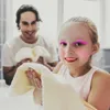 A father and daughter are in a bathroom, with the daughter wearing makeup. Voir les images du produit