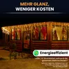 A wooden cabin decorated with icicle lights at night. Produktbild-Vorschau