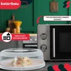 A kitchen scene with a microwave and a food cover. Podgląd zdjęcia produktu