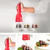 A collage of images showing a red electric spice grinder, its interchangeable spice pods, and a prepared dish seasoned with spices. Náhled obrázku produktu