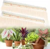 Two LED grow lights are shown above a collection of potted plants and gardening tools. Anteprima dell’immagine prodotto