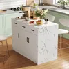A kitchen island with a marble-like countertop is set up in a modern kitchen, featuring a coffee maker, coffee bags, a vase of flowers, and a stack of pancakes. Voir les images du produit