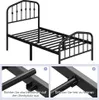 A black metal bed frame shown from a slightly elevated angle, with two inset images demonstrating assembly steps. Podgląd zdjęcia produktu