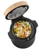 A rice cooker with rice and vegetables inside. Voir les images du produit
