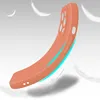 A flexible orange phone case is shown dynamically bending, with stylized feathers floating around it. Produktbild-Vorschau