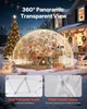 A transparent geodesic dome tent set up in a snowy yard during the evening, decorated with Christmas lights and near a decorated Christmas tree and house. Podgląd zdjęcia produktu