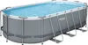 An oval-shaped above-ground swimming pool filled with blue water, supported by a gray metal frame. Anteprima dell’immagine prodotto