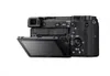 The back of a black Sony Alpha camera with its screen flipped out. Voir les images du produit