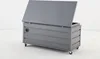 A gray storage box with its lid open, shown on a white background. Produktbild-Vorschau