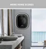 A modern bathroom with a wall-mounted washing machine and a view of the ocean. Anteprima dell’immagine prodotto