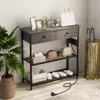 A console table with storage shelves and drawers, decorated with accessories like plants, picture frames, and bags, in a home entryway setting. Anteprima dell’immagine prodotto