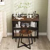 A vanity desk with a stool in a room. Anteprima dell’immagine prodotto