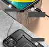 A close-up view of a black phone case, showing its rugged design and a charging cable plugged into a phone. Produktbild-Vorschau