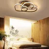 A modern bedroom with a bed, a large mural on the wall, and a unique ceiling light fixture. Náhled obrázku produktu