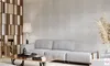 A modern living room with a sofa, coffee table, and decorative elements. Produktbild-Vorschau