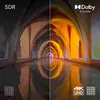 A split image comparing SDR and Dolby Vision display quality of a hallway with arches and reflections. Produktbild-Vorschau
