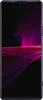 A smartphone with a purple frame and a dark background displaying a vibrant, abstract wallpaper with pink and purple wavy lines. Náhled obrázku produktu