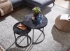 A living room setting with a sectional sofa, coffee tables, and a pouf. Anteprima dell’immagine prodotto