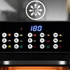 Close-up of an air fryer control panel with digital display and various cooking presets. Produktbild-Vorschau