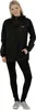 A woman wearing a black jacket and black leggings, standing against a white background. Produktbild-Vorschau
