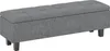 A dark gray upholstered storage bench with tufted top and dark wooden legs, shown from a slight angle against a white background. Produktbild-Vorschau